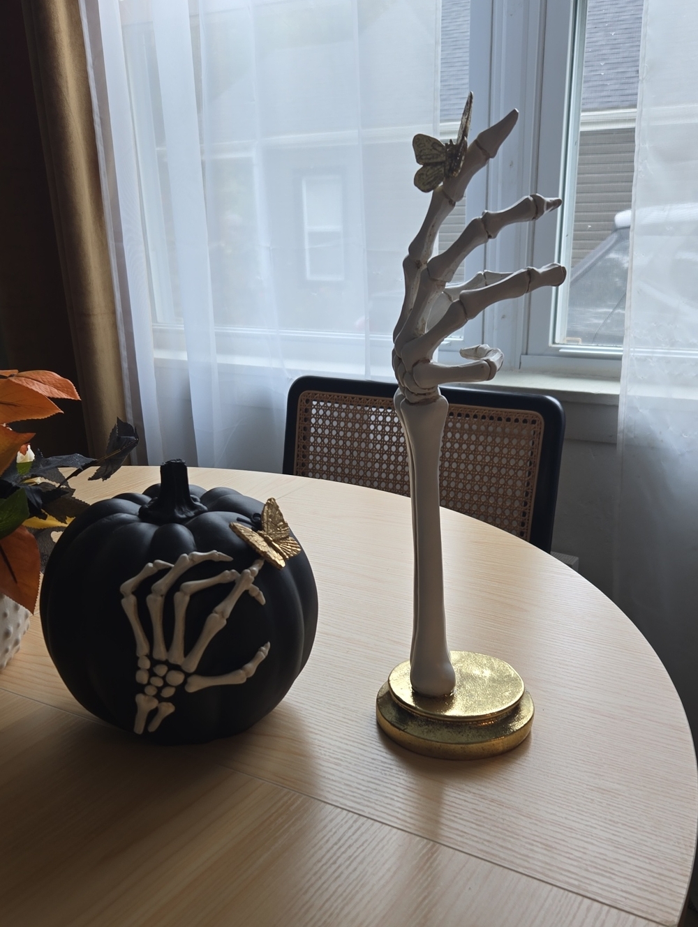 Halloween Skeleton Arm And Pumpkin With Butterflies